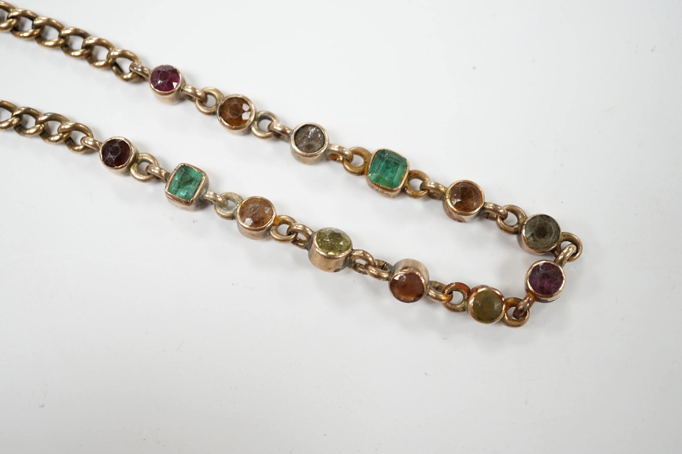 An early 20th century yellow metal and multi gem set bracelet, 19cm, gross weight 10.6 grams. Condition - poor